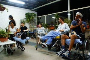 group of men sitting in their wheelchairs